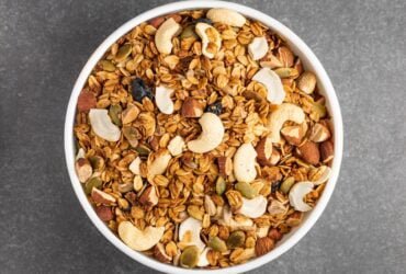 brown peanuts in white ceramic bowl
