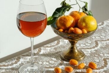 clear wine glass with red liquid inside