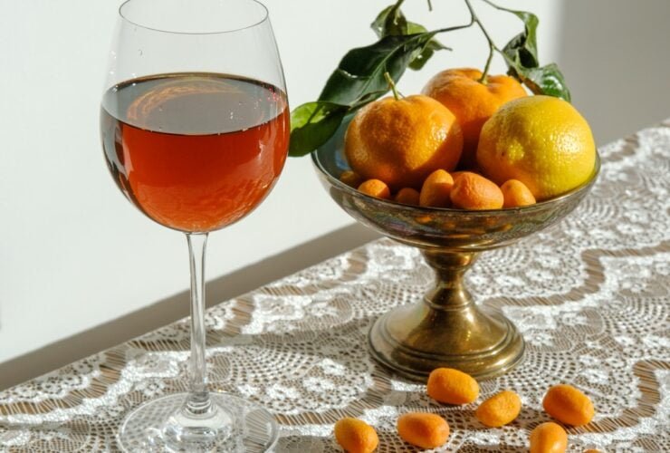 clear wine glass with red liquid inside
