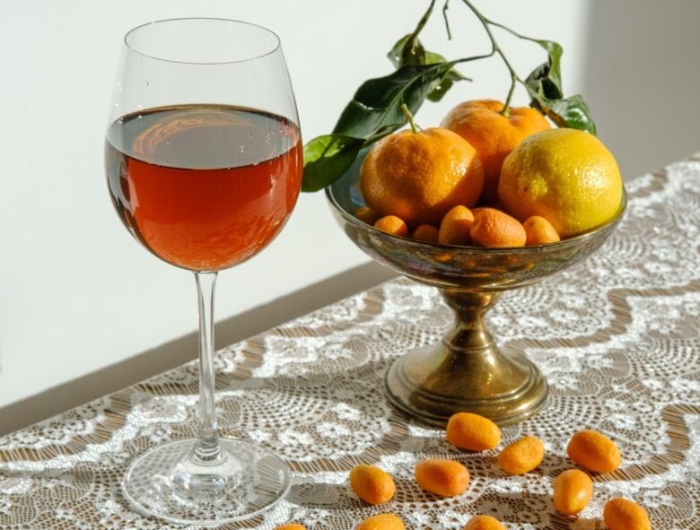 clear wine glass with red liquid inside
