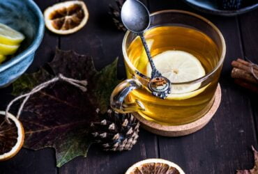 clear glass teacup on table