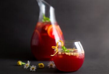 clear drinking glass with red liquid