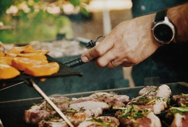 person grilling meat