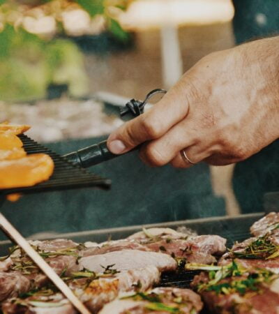 person grilling meat