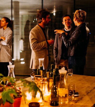 five person standing while talking each other