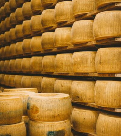 a group of white containers with brown powder on them