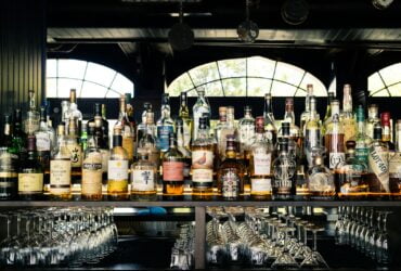 assorted liquor bottles on table