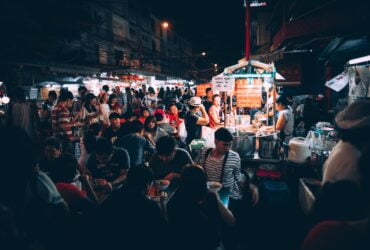 people eating on street