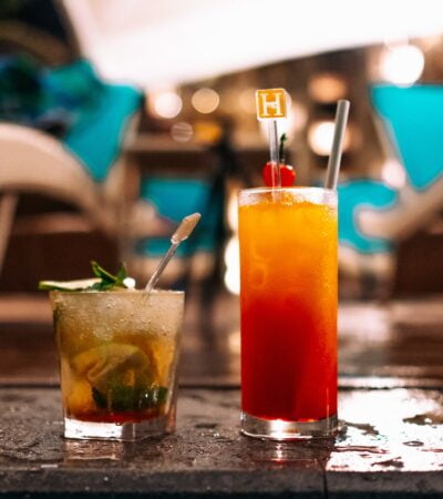 two drinks sitting on top of a table next to each other