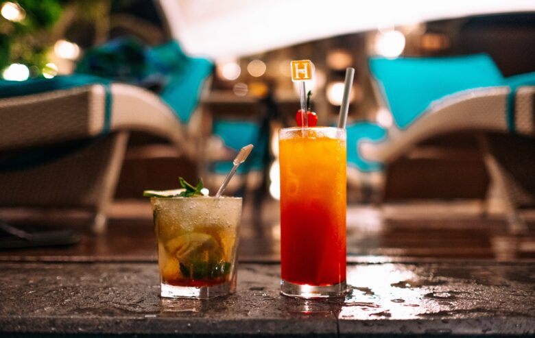 two drinks sitting on top of a table next to each other
