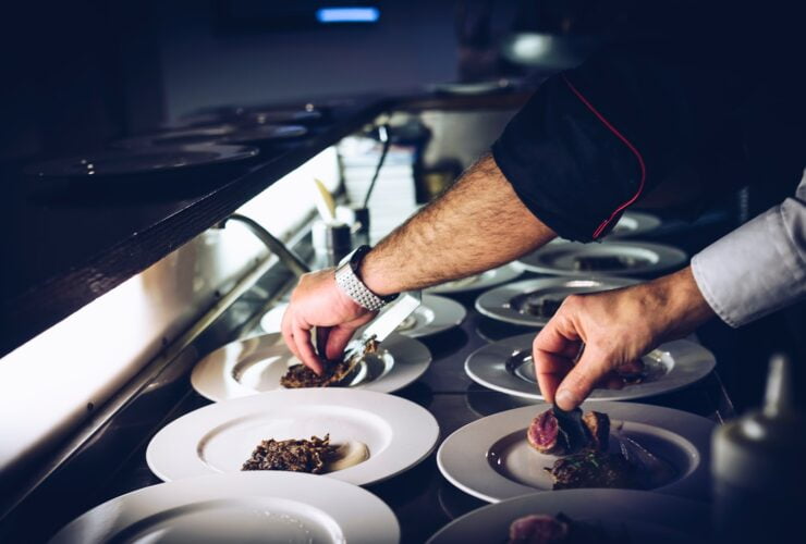person preparing cooked dish
