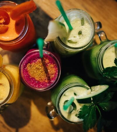 six clear glass filled with liquids