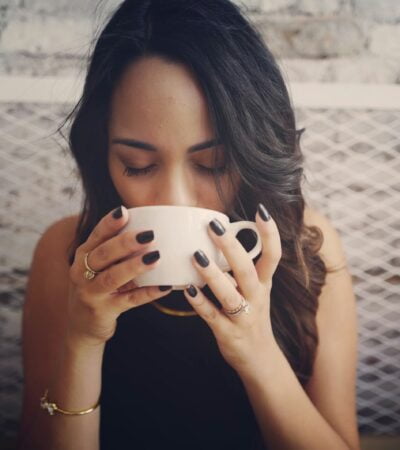 woman drinking with cup